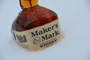 Photo of Makers Mark Kentucky Whiskey in snow